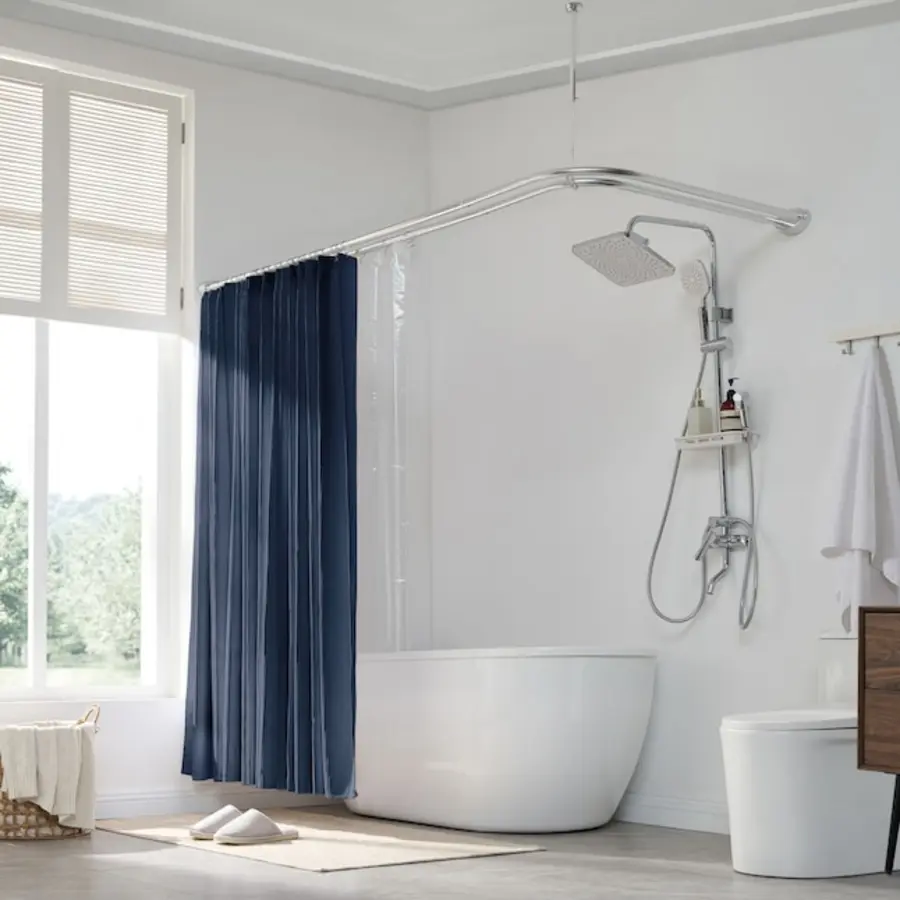 A bathroom features a shower curtain on a rod above a tub and a handheld showerhead.